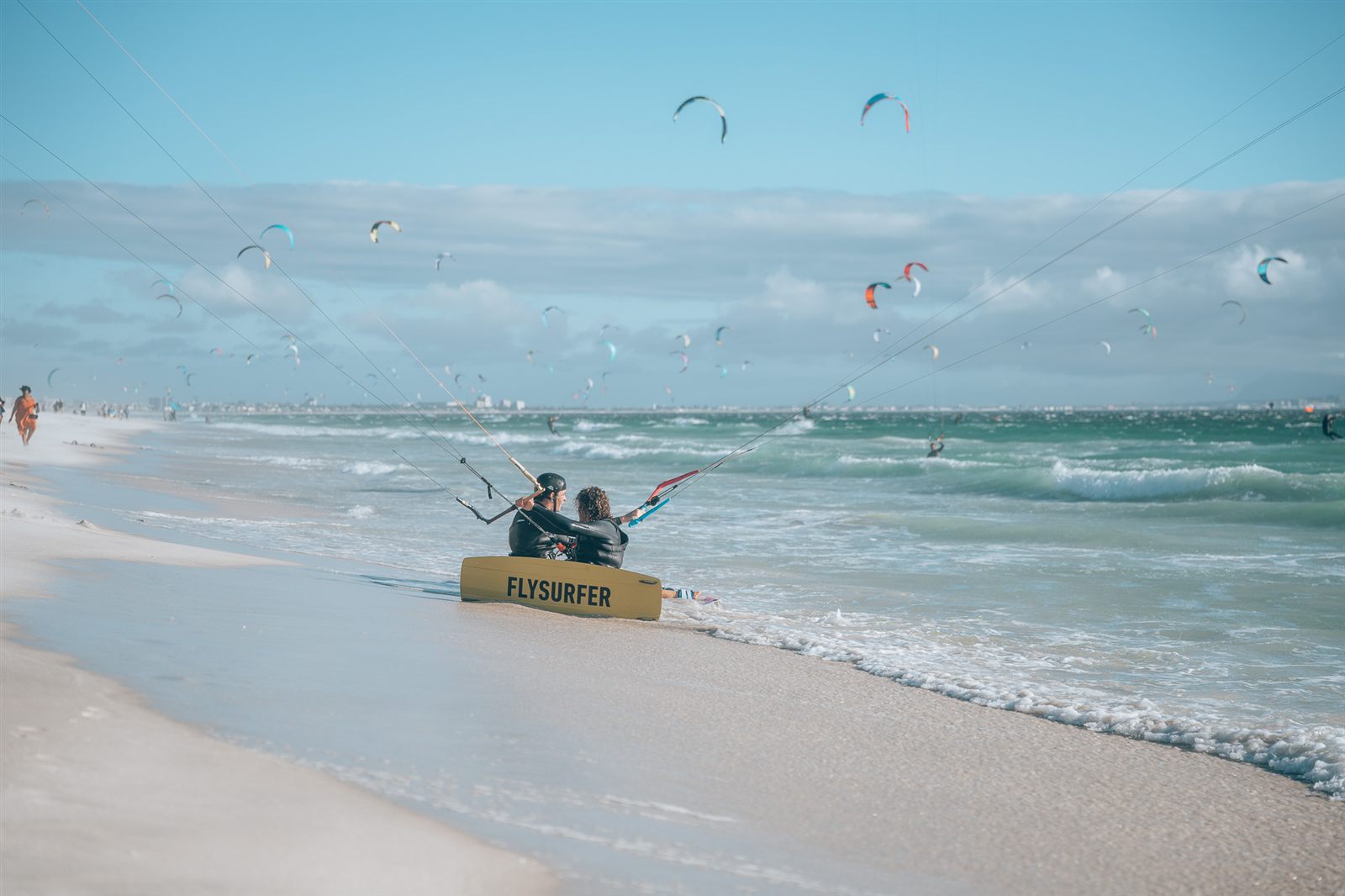 Peak season at Kite Beach, the sky full of kites