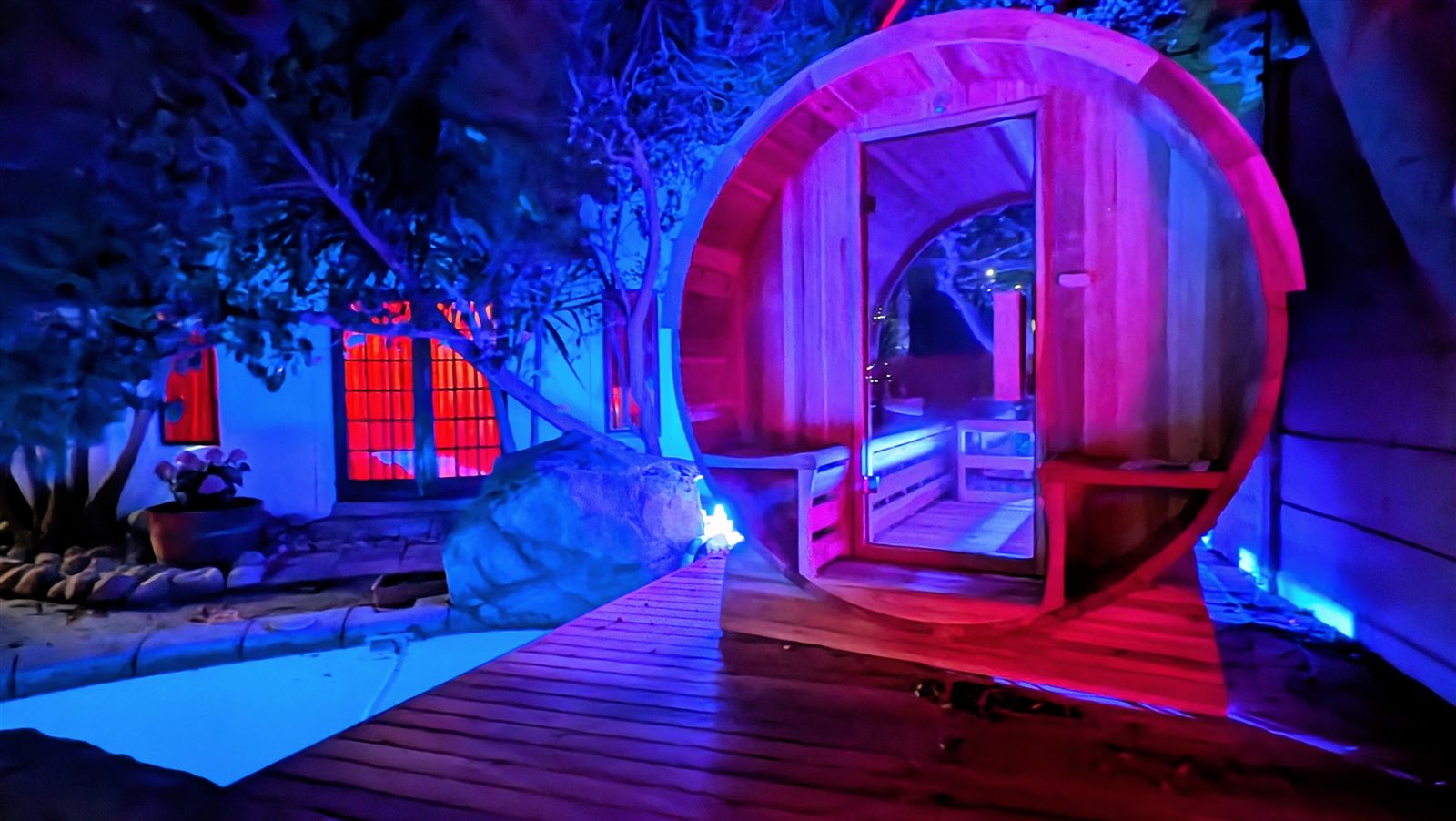 The Secret Sauna lit up at night for a social session